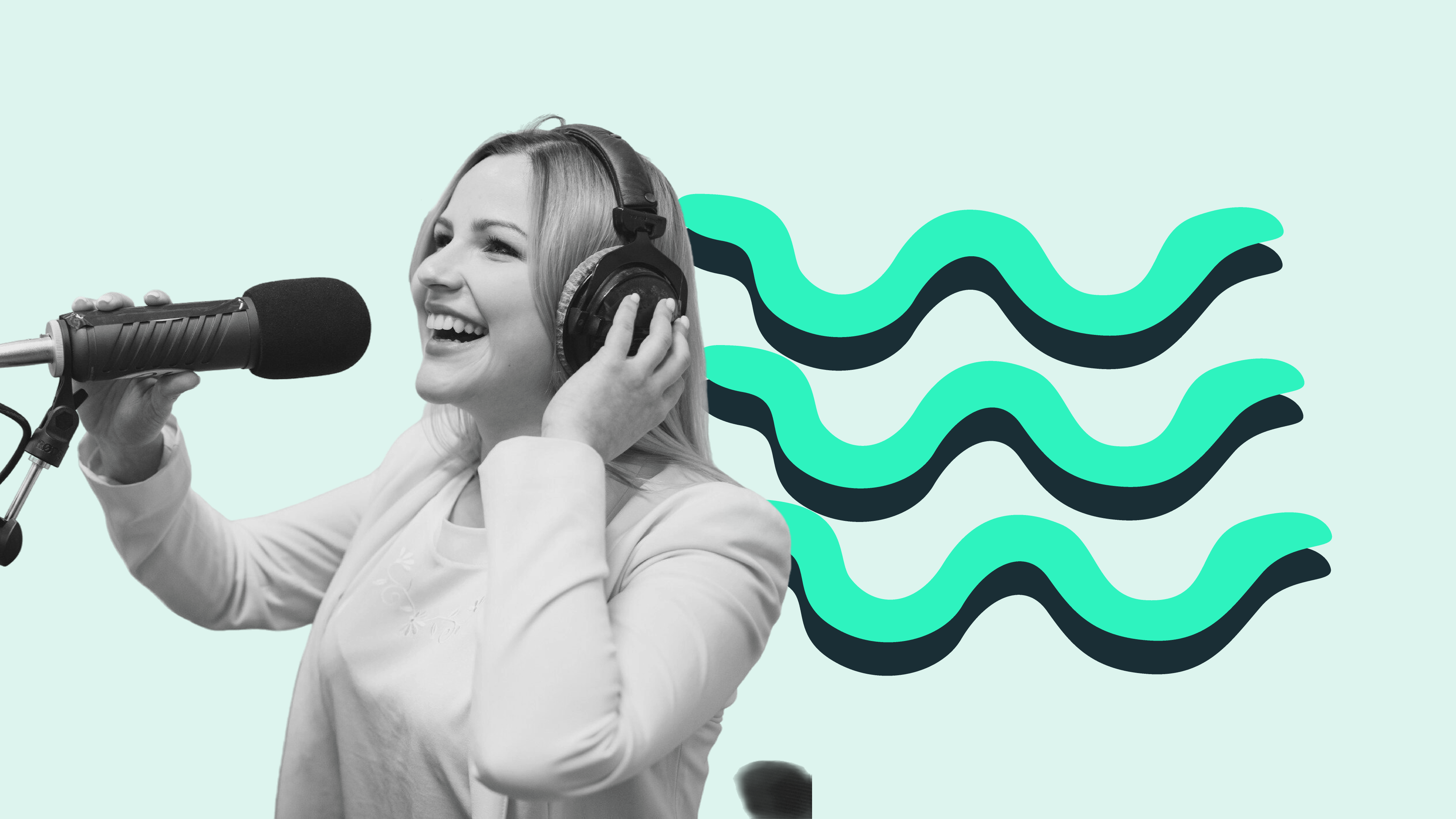 A woman wearing headphones speaks into a microphone to record her podcast